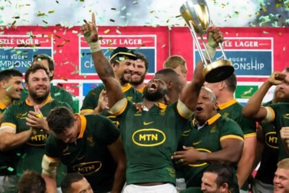 South africa players celebrate with the trophy after defeating argentina and winning the rugby champ.jpeg