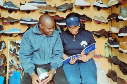 4g capitals field agent takes a customer through a customised business skills training session.jpg