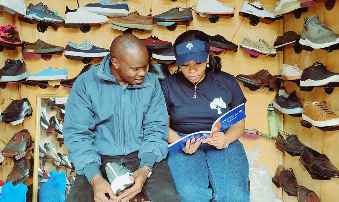 4g capitals field agent takes a customer through a customised business skills training session.jpg