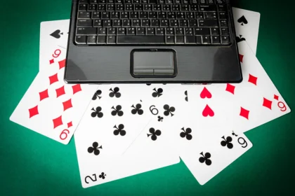 Bloombergquint2f2025 08 192fa9ch6upw2flaptop with playing cards on green background 2025 02 22 03.webp