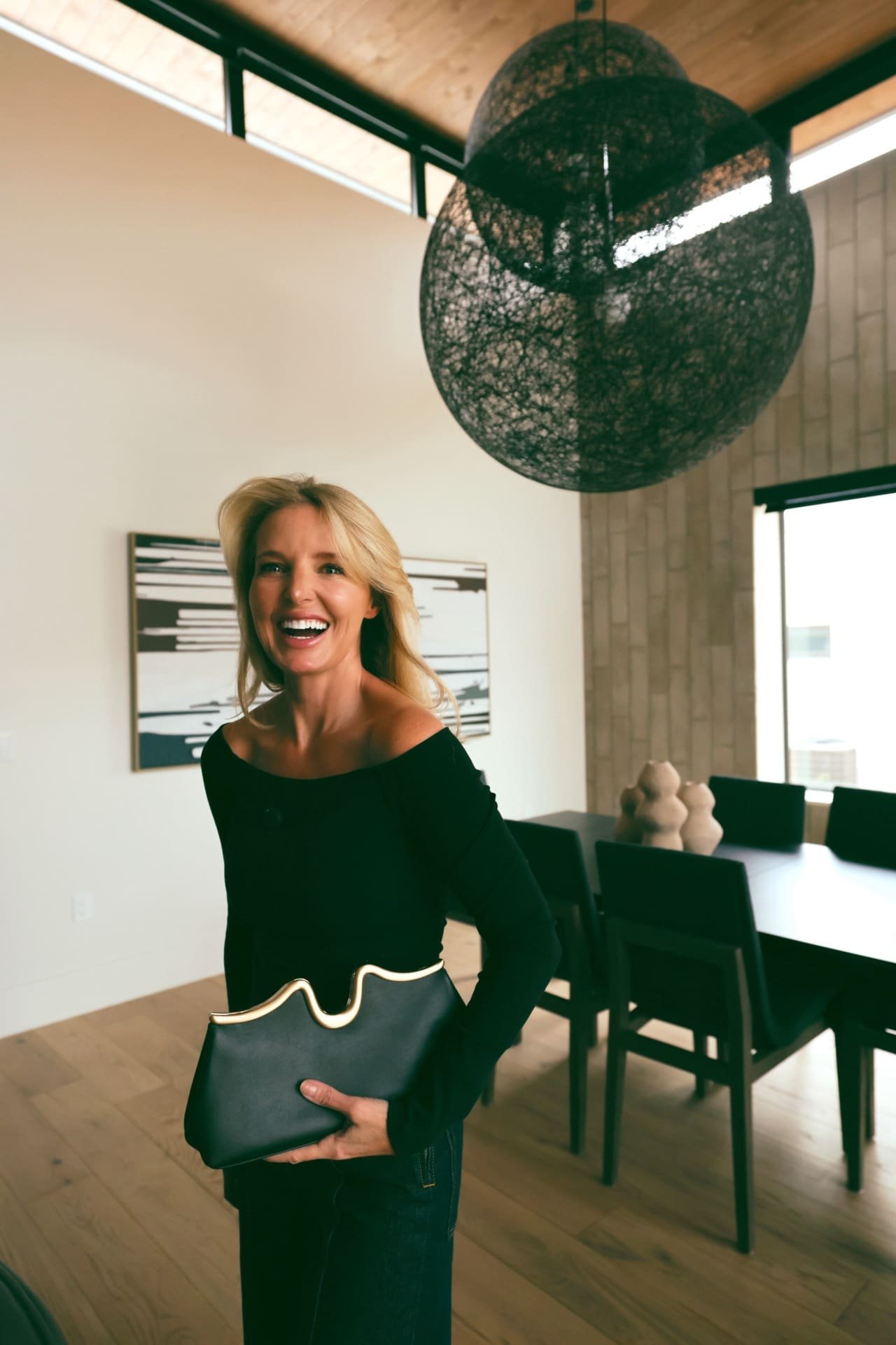 Good american ribbed long sleeve black top ulla johnson wide leg jeans cult gaia clutch.jpg