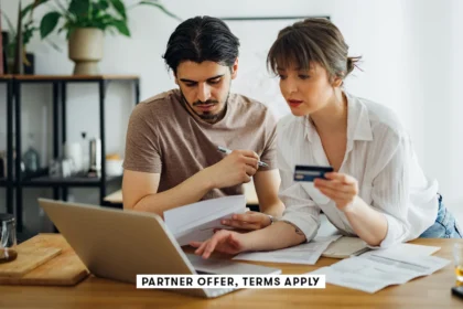 20250715 social disclaimer parter offer terms apply couple paying bils at home with credit card mini.webp