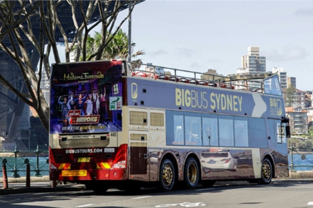 A Sydney Hop on hop off tour bus with open air seats to enjoy the sights.jpg