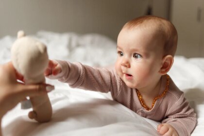 Baby girl playing whith toy.jpg