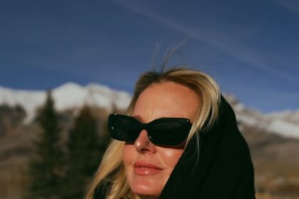 Black infinity scarf worn as a hood with elisa johnson black sunglasses 2.jpg