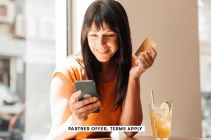 SOCIAL IMAGE PARTNER OFFER TERMS APPLY woman with credit card using smart phone in cafe Westend61 30.webp