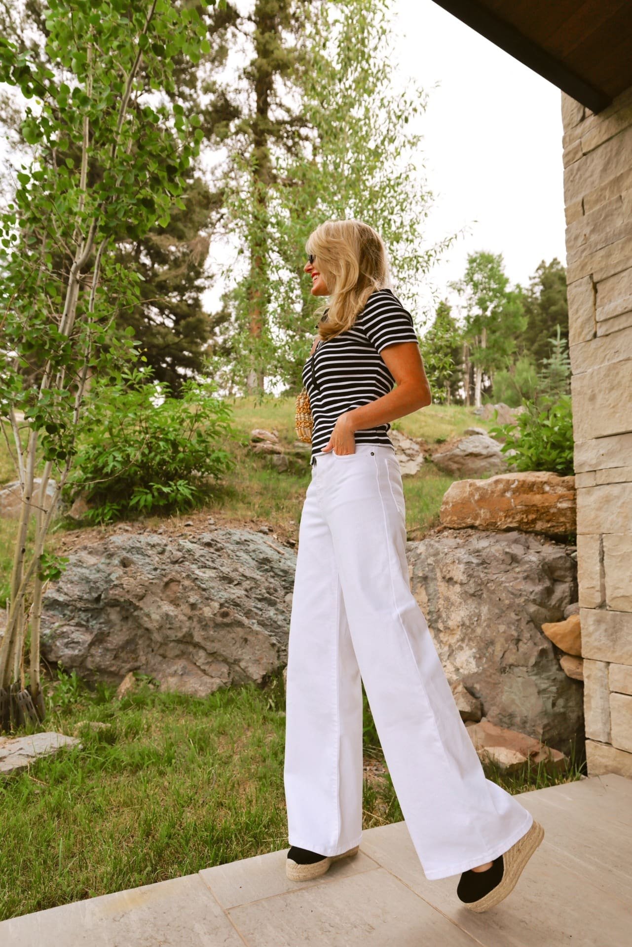 1776466968 East Coast Summer style trend featuring striped polo shirt white wide leg jeans by FRAME and Staud b.jpeg