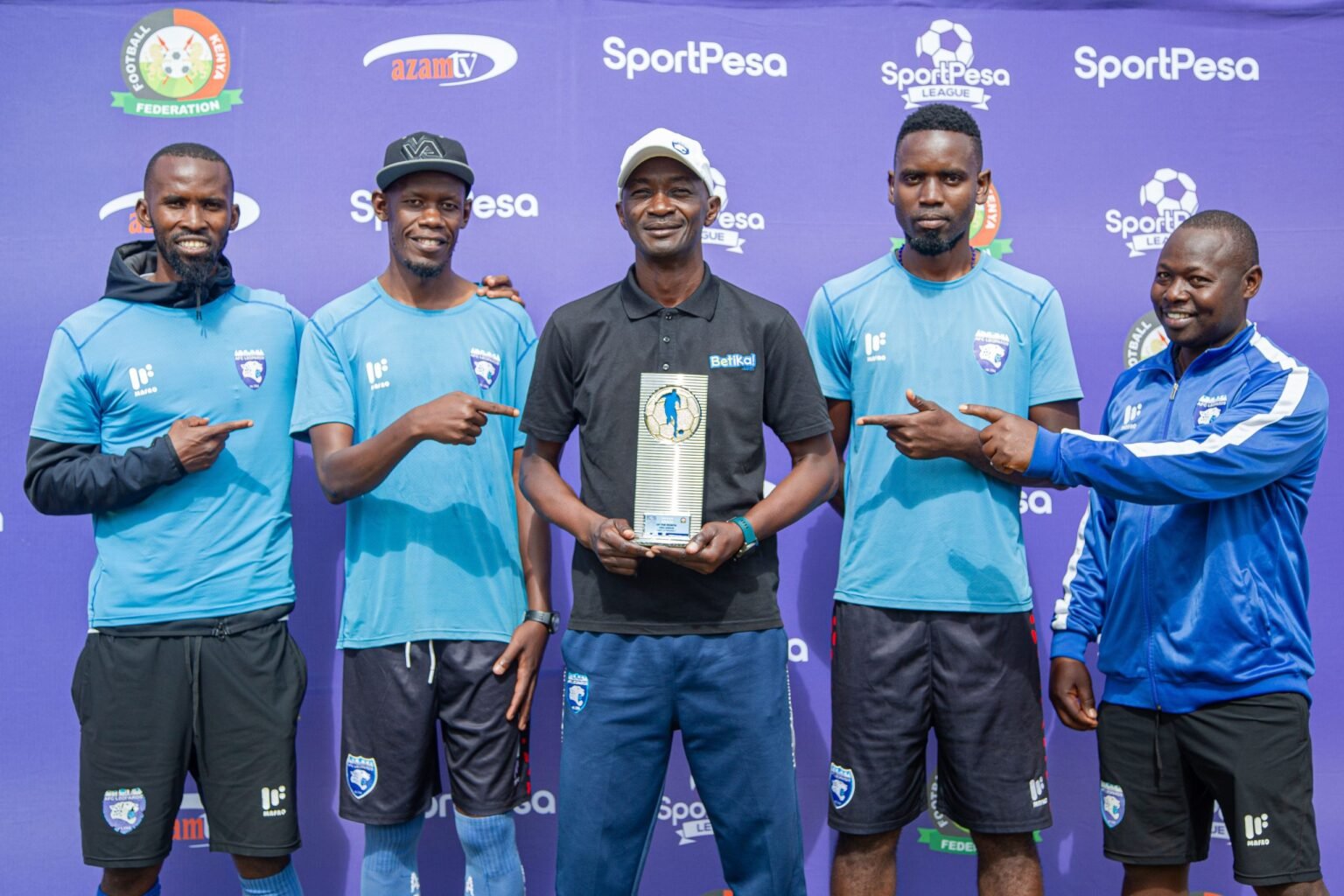 AFC Leopards Boss Fred Ambani displays his SportPesa League Coach of the Month award for March flank.jpeg