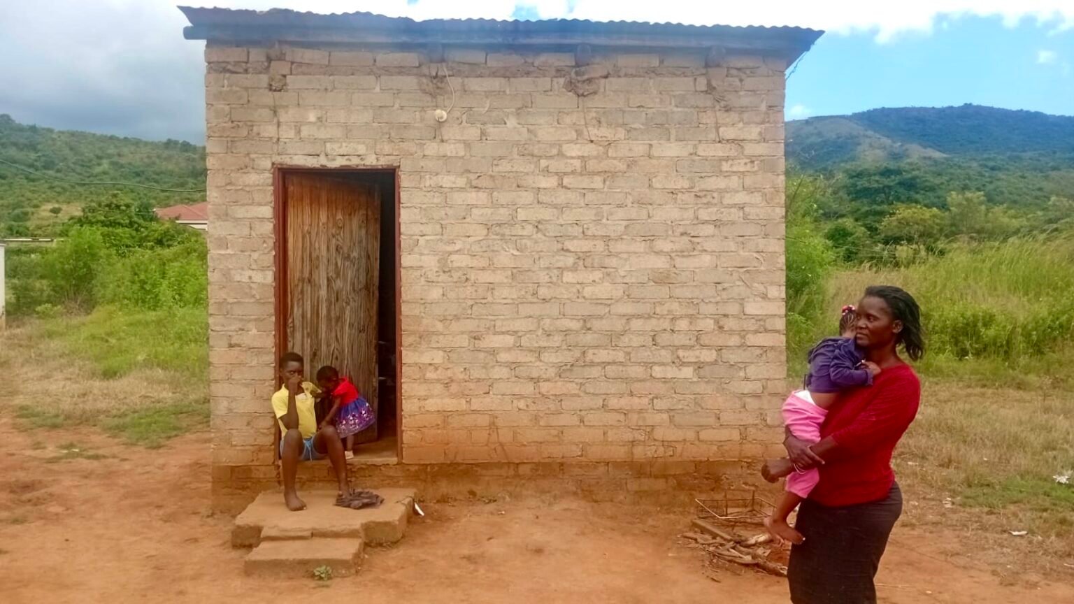 Andronicca Rasebotsa and her three children live in a cramped one room structure.jpg