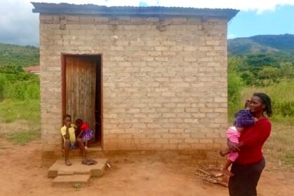 Andronicca Rasebotsa and her three children live in a cramped one room structure.jpg