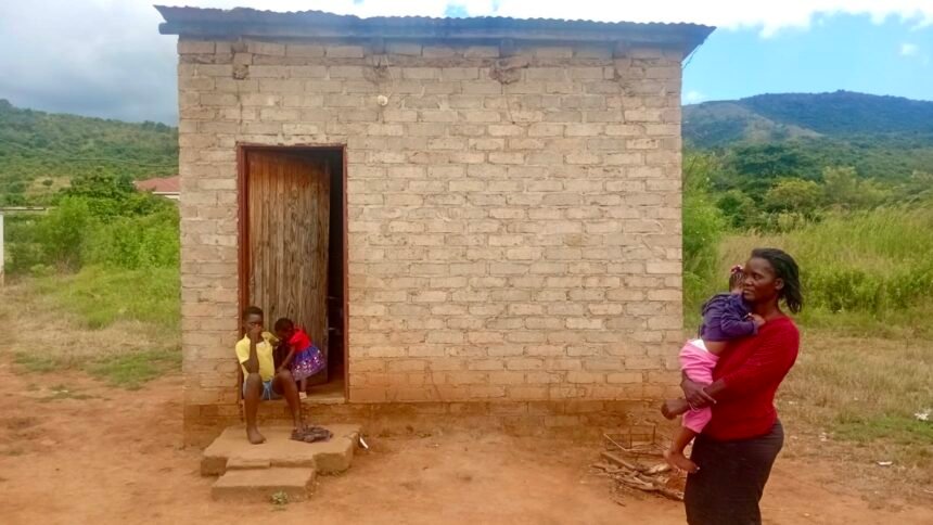 Andronicca Rasebotsa and her three children live in a cramped one room structure.jpg