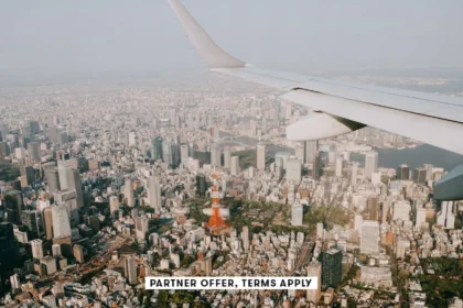 SOCIAL IMAGE PARTNER OFFER TERMS APPLY Tokyo skyline with Tokyo Tower from airplane window Ippei Nao.webp