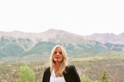AG Farrah bootcut jeans paired with black booties by Schutz and Veronica Beard black blazer 4 scaled.jpeg