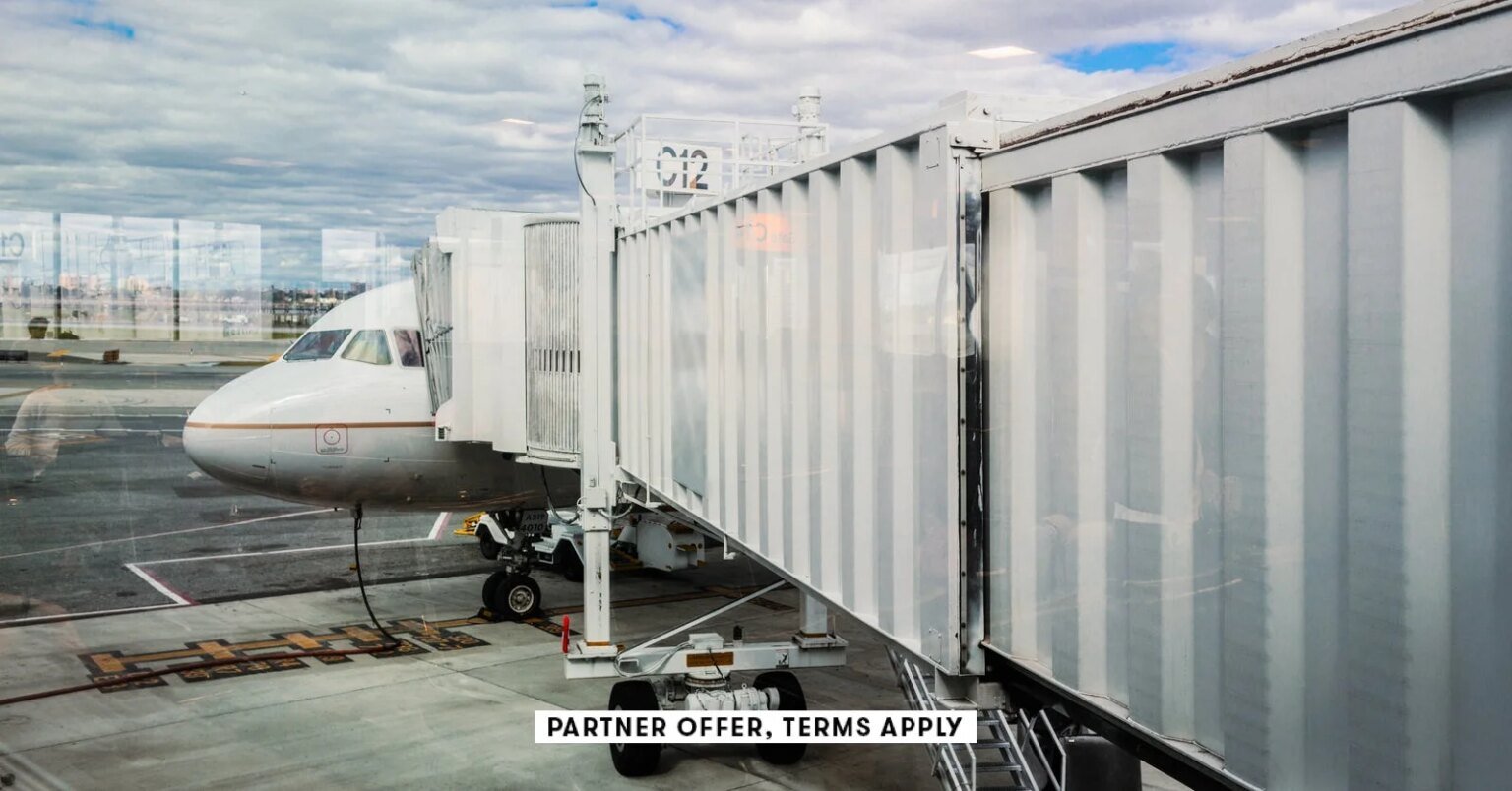 SOCIAL IMAGE PARTNER OFFER TERMS APPLY Walkway to airplane on runway Eric Raptosh Photography 4.jpg