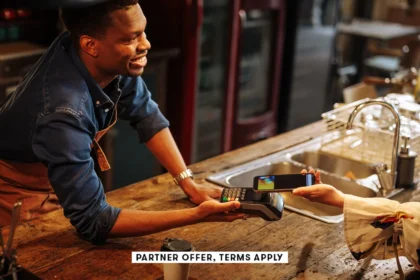 SOCIAL IMAGE PARTNER OFFERS TERMS APPLY Bartender holding contactless payment terminal for person to.webp