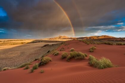 Rain and rainbow red dunes namibia 211034266.jpg