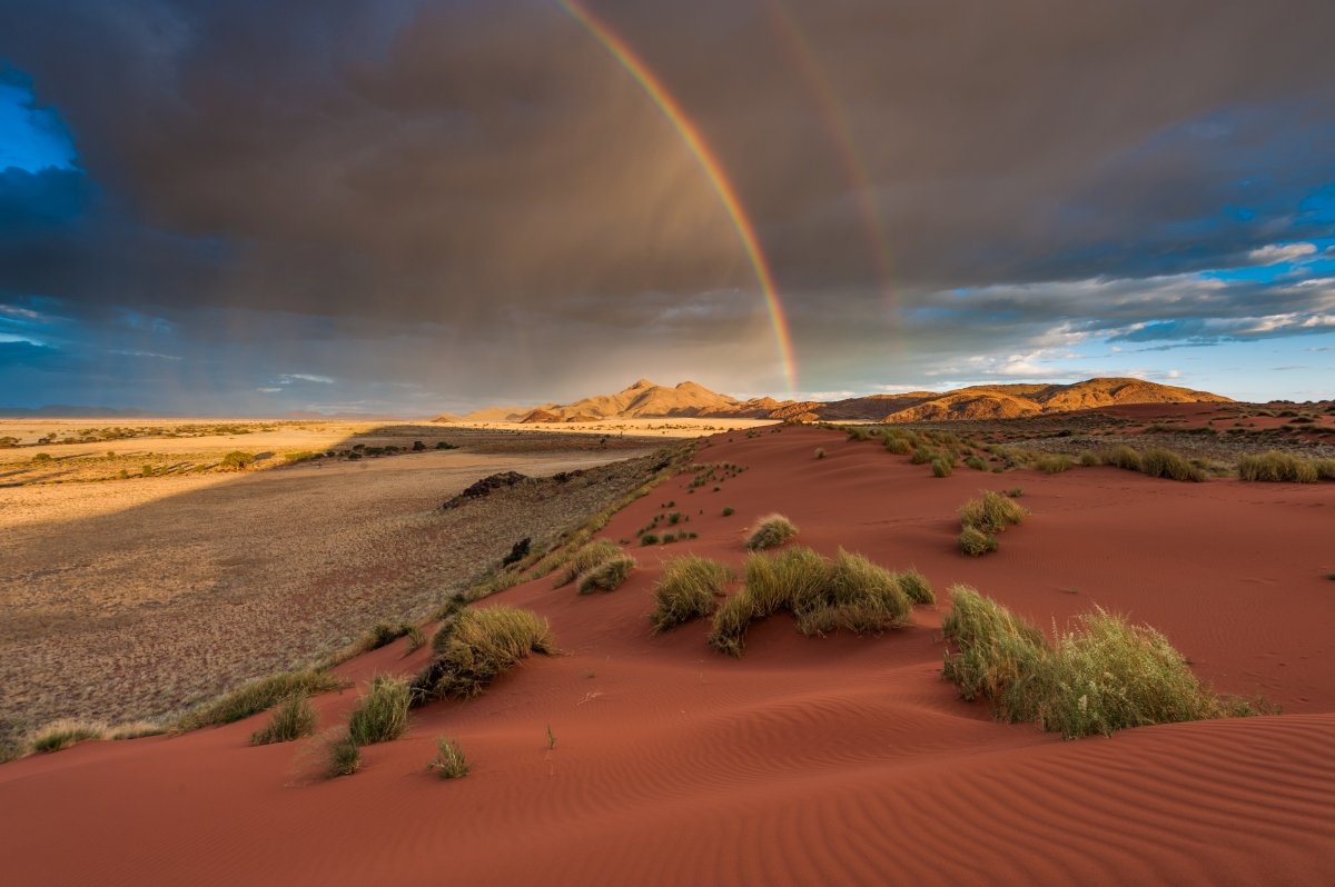 Rain and rainbow red dunes namibia 211034266.jpg